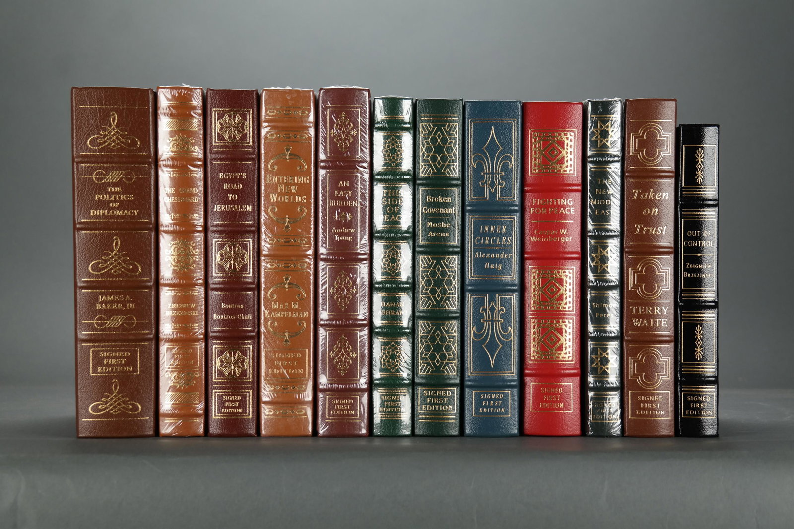 Easton. 12 vols. Foreign Policy. Signed.: [Easton Press/Signed] 12 volumes. Foreign Policy & Politics. Full leather with gilt lettering and decorations. Includes: (1) Brzezinski, Zbigniew. The Grand Chessboard. (2) Baker III, James A. The Pol