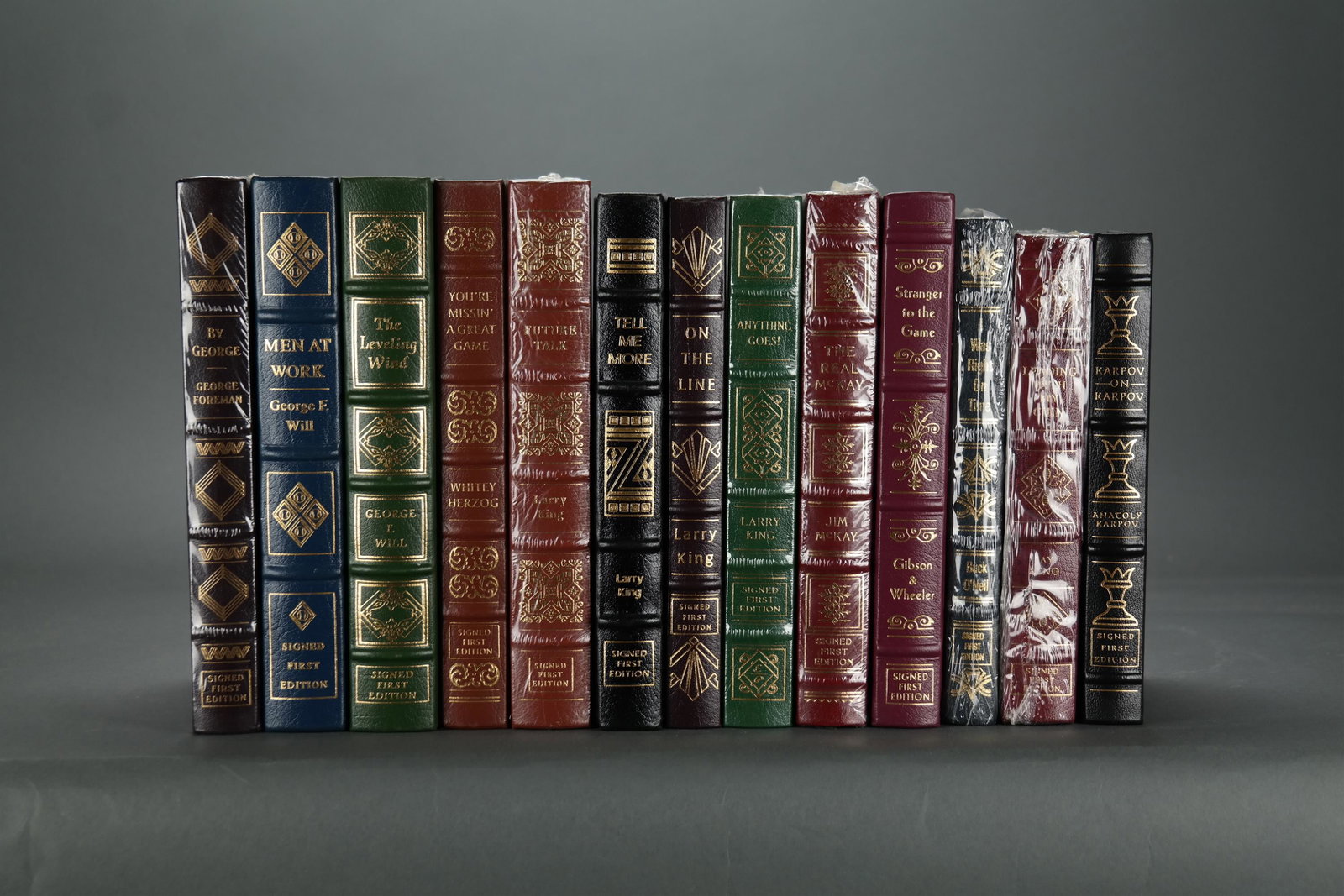 Easton. 13 vols. Sports and Media. Signed.: [Easton Press/Signed] 13 volumes. Sports and Media. Full leather with gilt lettering and decorations. Includes: (1) Karpov, Anatoly. Karpov on Karpov. (2) Foreman, George. By George. Condition Near fi