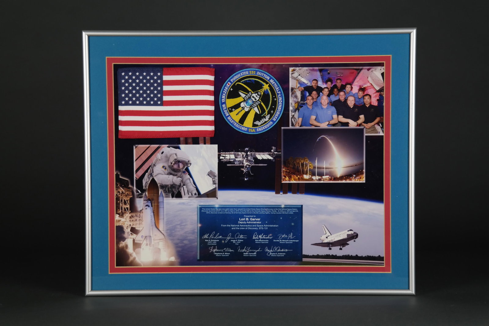 Space Shuttle Discovery Flown Flag and Patch. 2010: [NASA] Flown American Flag and Crew Patch carried aboard the Space Shuttle Atlantis during the STSâ€“131 mission to the International Space Station, April 5-20, 2010. Presented to Lori Garver, th