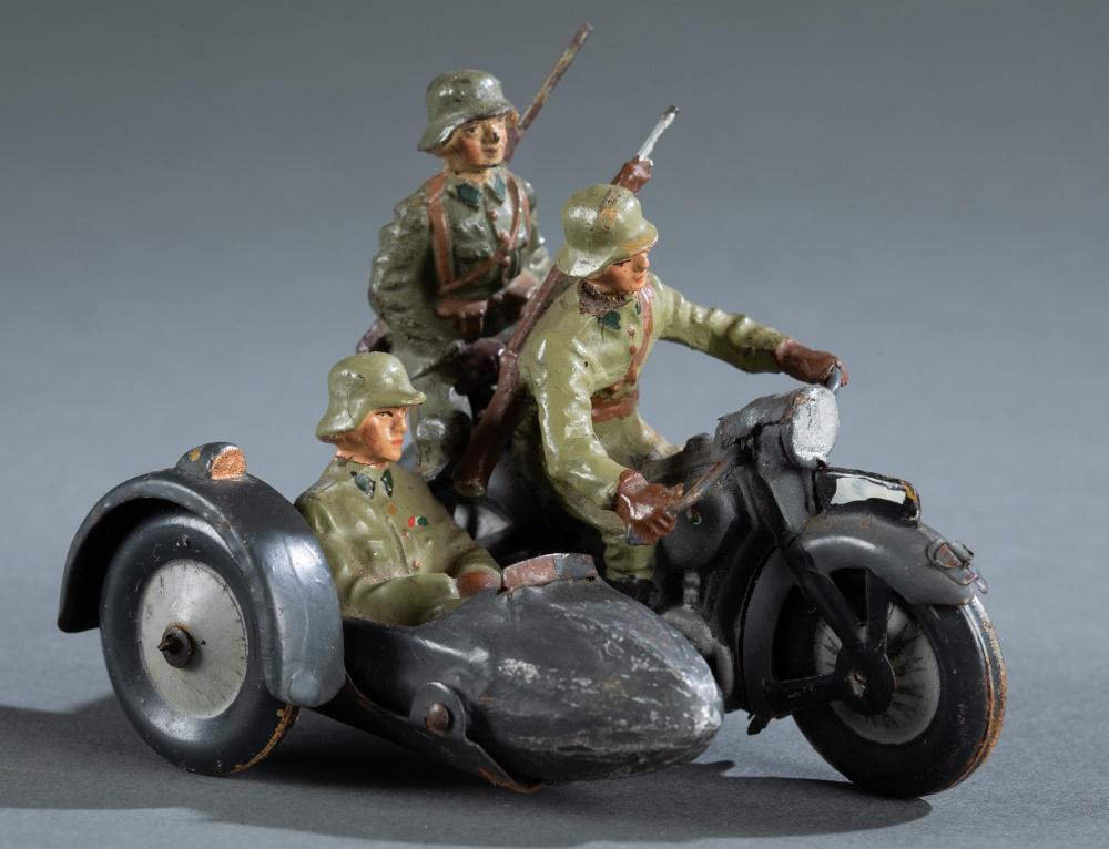1930s Lineol military motorcycle figure.: A 1930s German Lineol composition and tin plate military motorcycle with sidecar figure. 2 3/4" x 4 1/2" x 2 1/2" Condition: Wear consistent with age. rear figure on motorcycle has missing foot and to