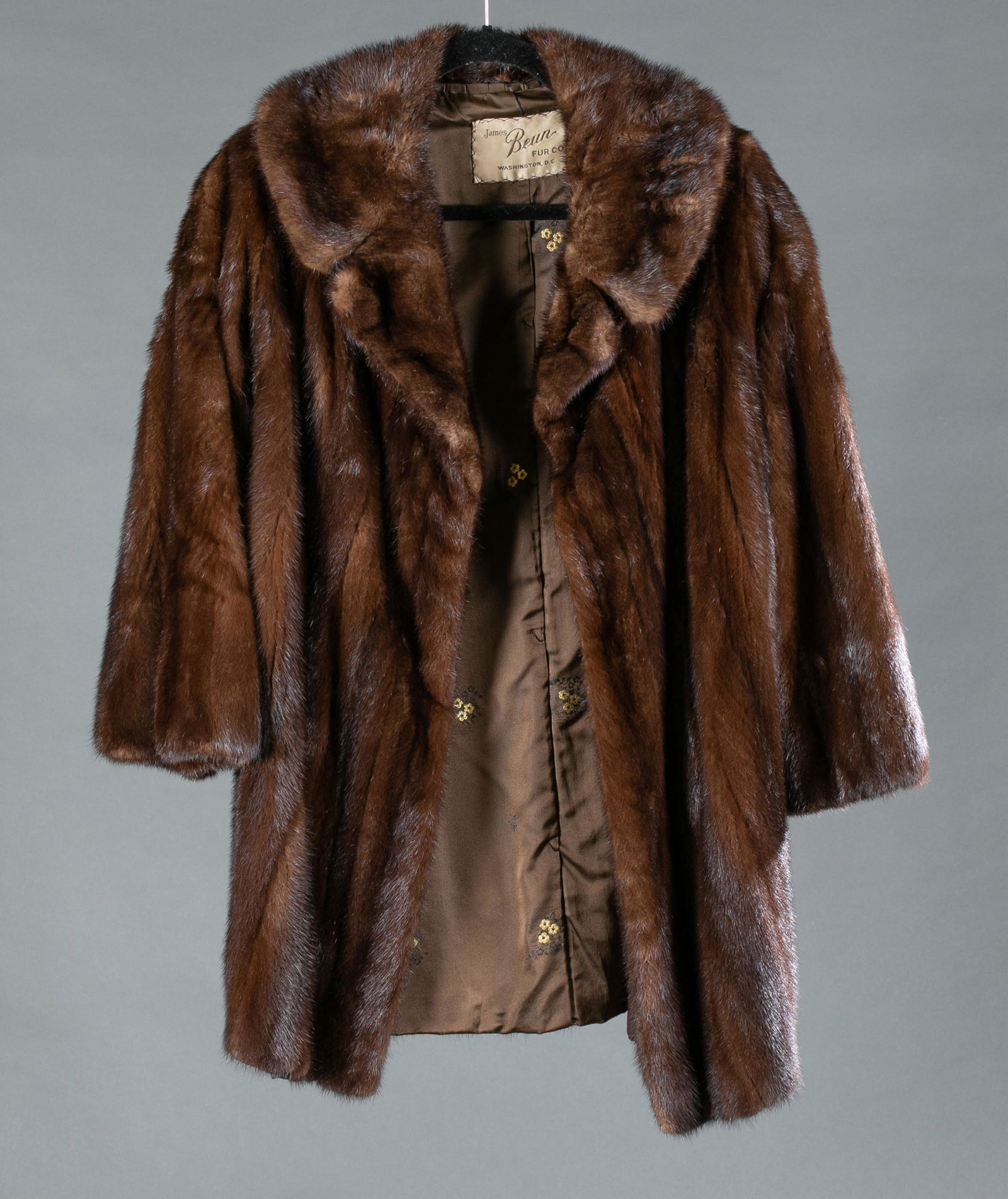 Brown mink James Beun Fur Co., coat.: A brown mink fur by James Beun Fur Co. coat. Washington D.C. Satin lining embroidered with previous owner name. Bust: Approx, 42". Length: Approx, 33". Condition: Wear to satin lining and metallic thr