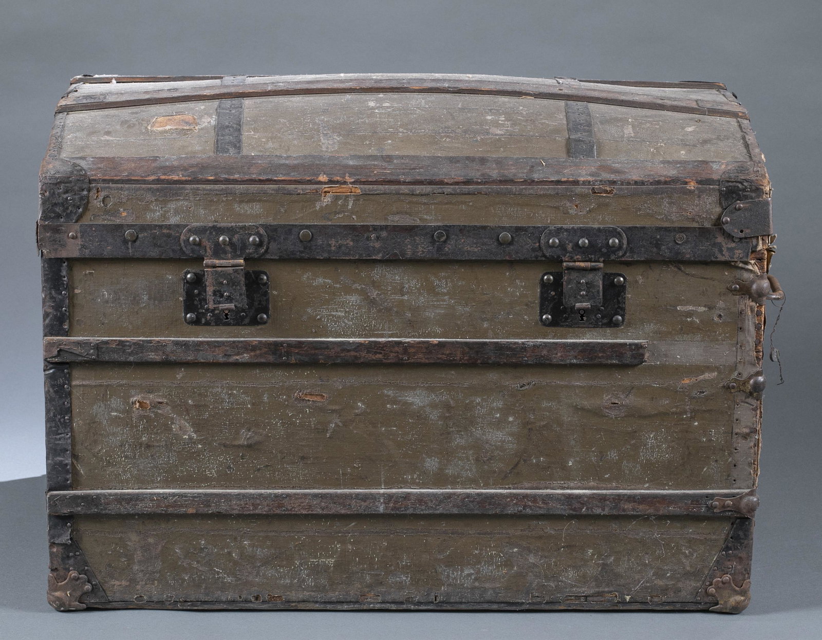 Louis Vuitton, "Trianon" trunk, 1860's.: A Louis Vuitton "Trianon" dome top trunk. Paris, France. 1860's. Serial number 5725. Painted gray canvas on wood with metal handles, locks, and reinforcement edges. Wood and metal battens. Monogram "M