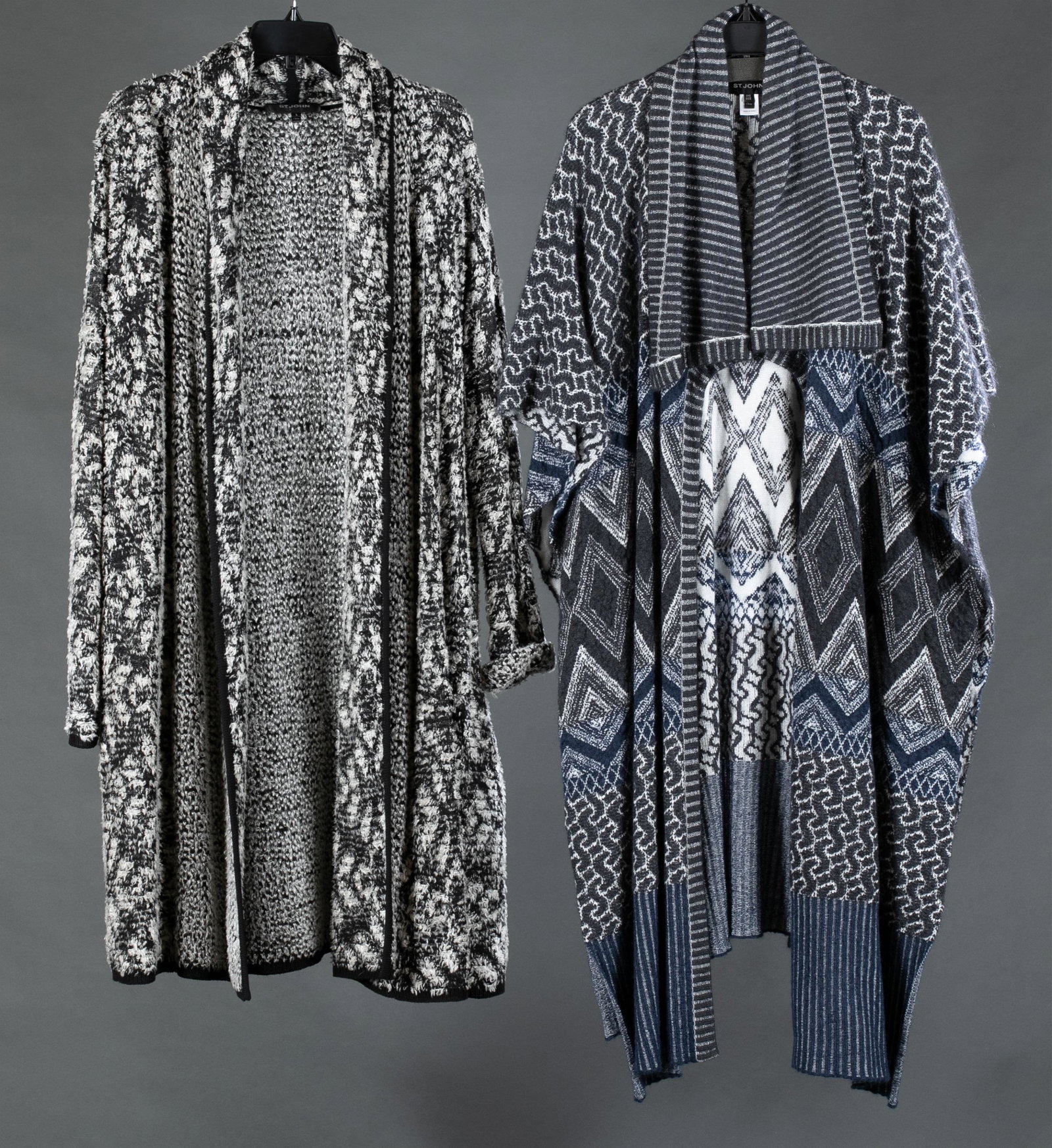 2 St. John oversized cardigans.: A group of two St. John oversized cardigans. ++Black and white long sleeved wool blend cardigan. Size Large. ++ Gray and white draped neck shawl cardigan. One size.