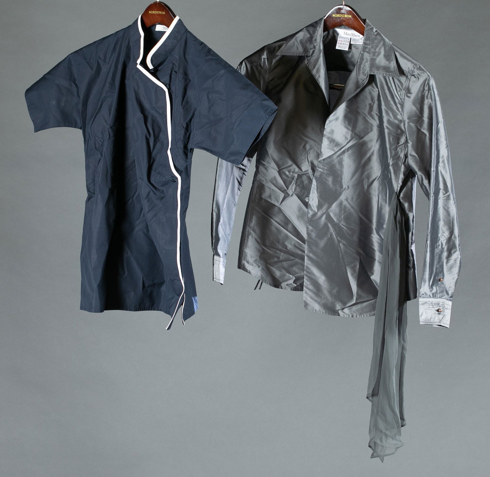 Prada and Max Mara blouses.: A group of two blouses. ++Prada navy blue short sleeve blouse with white trim and mandarin collar. Size 40. ++ Max Mara gray silk blend belted jacket. Size 4.