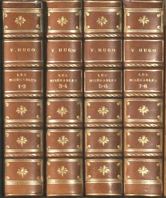 Hugo, Victor. Les Miserables [in French]. 8 Vols: Hugo, Victor. Les Miserables [in French]. 8 Vols in 4. Paris: J. Hetzel, (c1862). Brentano's half blue leather, marbled boards & endpapers, teg. Spines uniformly faded tan, light wear to corners. Very
