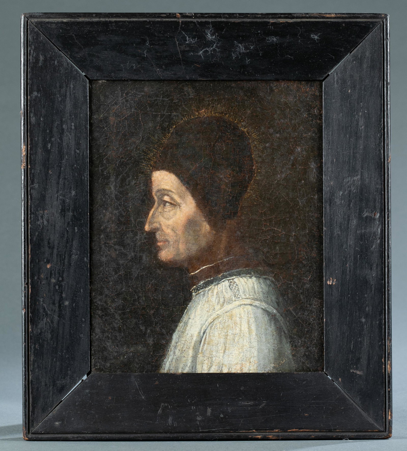 Continental School, Portrait of a Saint, 18th/19th: Continental School. A small profile portrait of a Saint. 18th/ early 19th century. Oil on canvas. Unsigned. 9" x 7 1/2". Frame: 17 1/2" x 11". Condition: Craquelure throughout.