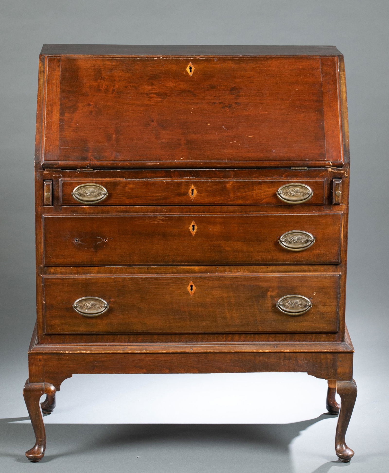 American Queen Anne style drop front bureau.: An American Queen Anne style walnut drop front bureau, 19th century. Bureau has drop front desk with eight drawers over three drawers raised on cabriole legs with pad feet. 36" x 30 1/2" x 16" Shippin