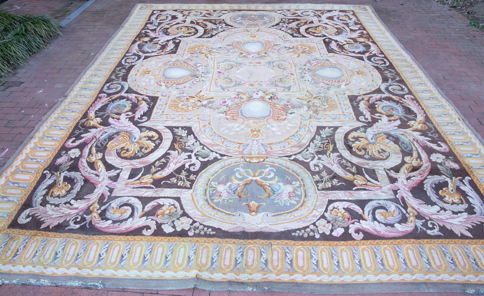 French Aubusson rug, 20th c.: A French Aubusson rug. 20th century. Wool blend. Central cream field medallion surrounded by strapwork and rococo motifs. Linen backed. 16' x 13' 1/2'. Shipping: This lot does not qualify for in house