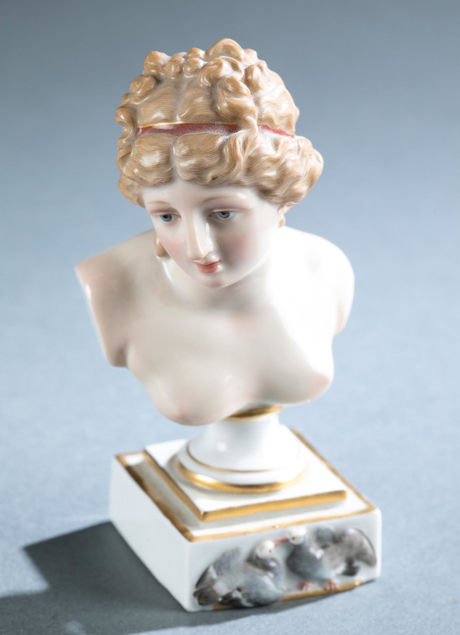 Meissen porcelain bust of Goddess Venus.: A Meissen porcelain bust of Goddess Venus, circa 1815-1924. Features Classical nude woman bust over a relief of dove couple. Marked on bottom with under glaze crossed swords with pommels, model number