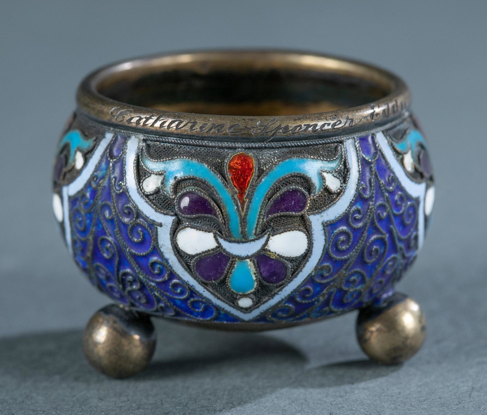 Imperial Russian enamel and silver salt cellar.: An Imperial Russian enamel and gold washed .875 silver standard salt cellar, circa 1891. On bottom is Moscow town mark, A.P. 1891 assay mark, 84 silver standard, and illegible makers mark. 1" x 1 1/2"