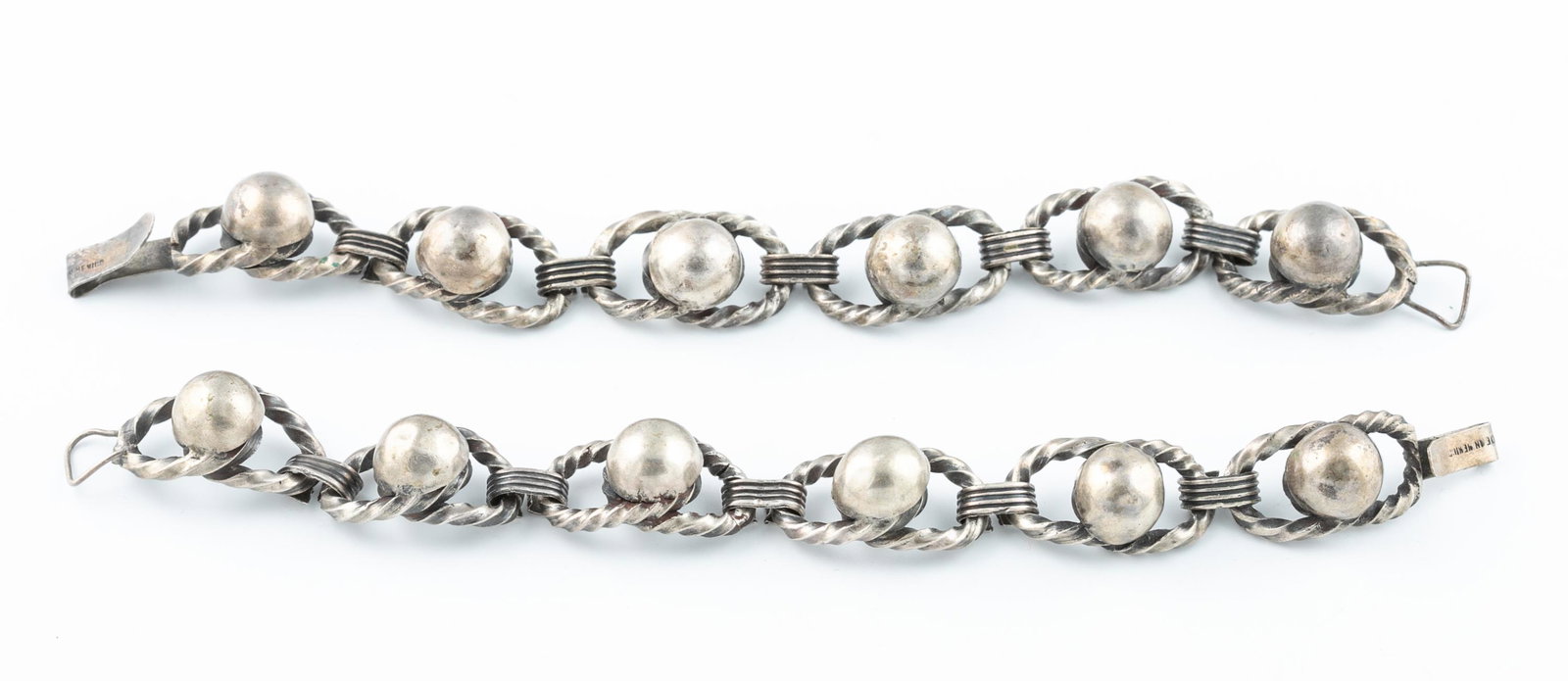 2 Mexican silver link bracelets.: A pair of Mexican silver circle link bracelets with hook and eye clasps. Stamped "Made in Mexico" on clasp. 8". Approx, 100.6g.