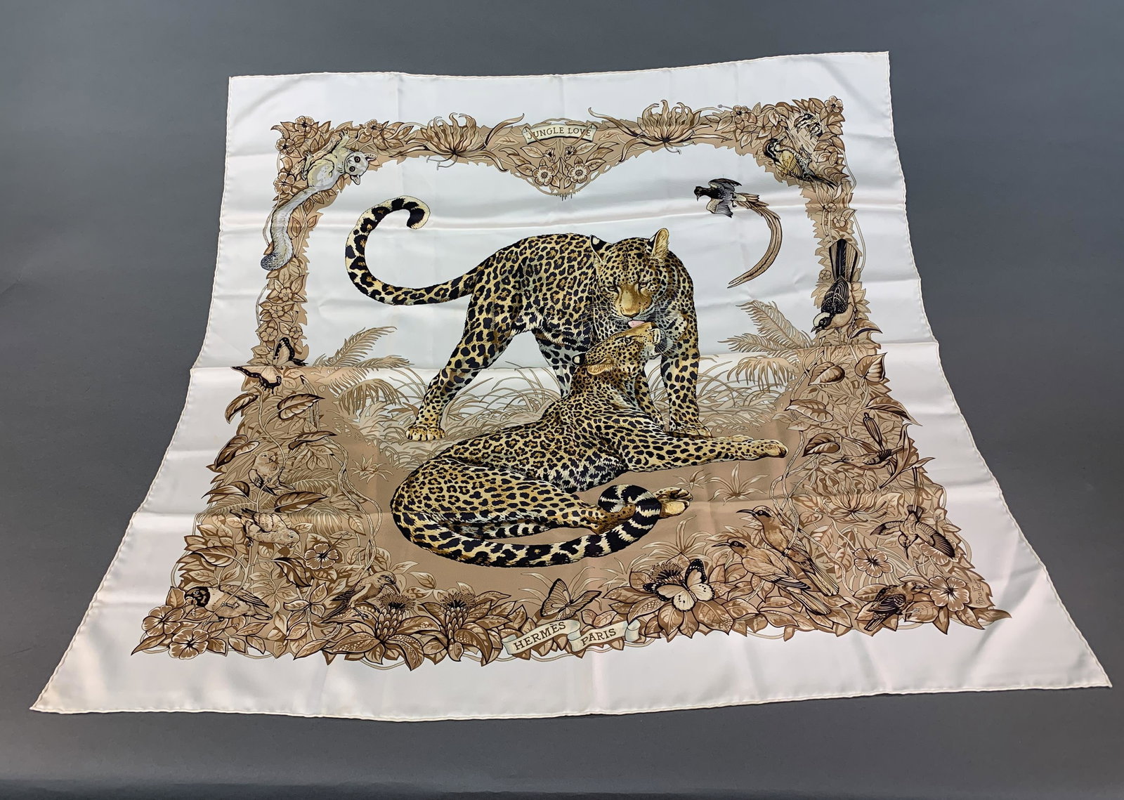 Hermes "Jungle Love" silk scarf: Hermes "Jungle Love" 100% silk scarf. 35" x 35"
