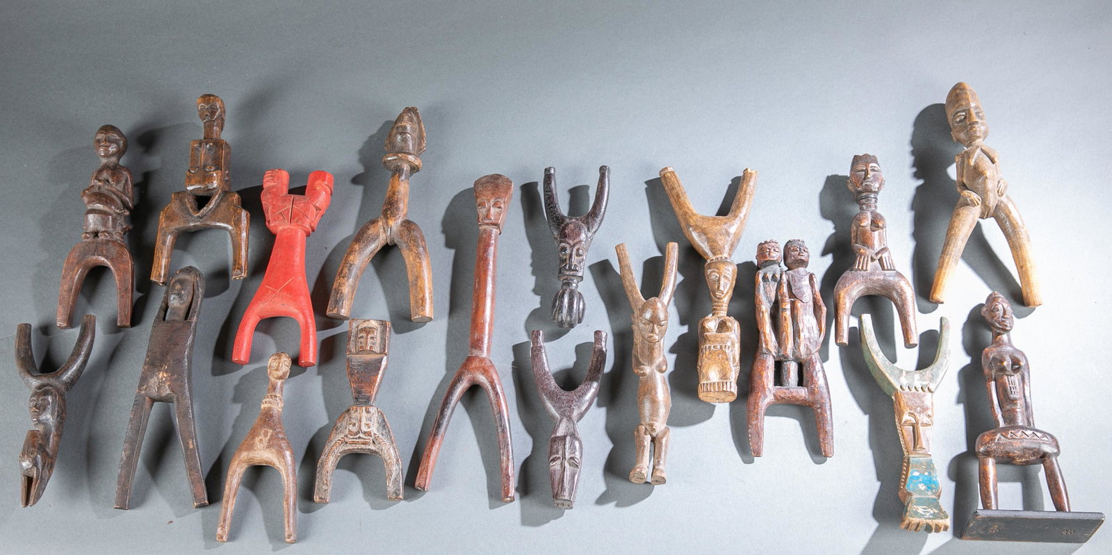 18 West African Style Slingshots.: A group of Eighteen West African Style Slingshots. Smallest: 7" x 2 3/4" x 1". Largest: 12 1/2" x 3 1/4" x 1".Shipping: Shipping for our Collector's Series Ethnographic Auction will be handled by our 