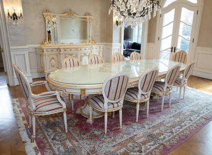 Italian Louis XV dining table and eight chairs: An Italian Louis XV dining table and eight chairs. Meroni Francesco E Figli for Versailles Galleries. Table has craquelure cream colored finish with painted floral design, gold accents, and hanging