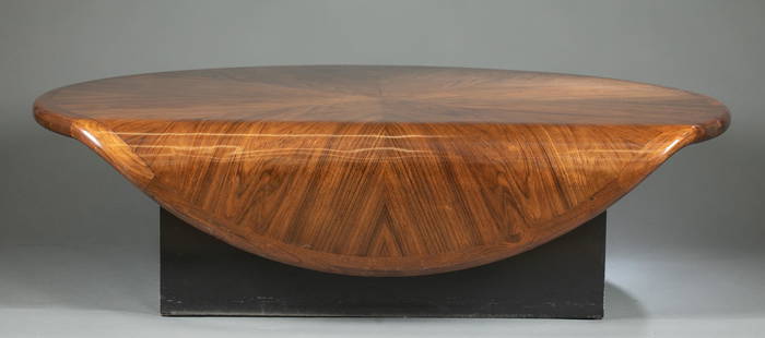 Contemporary waterfall table.: A contemporary waterfall table. Book matched veneer top. Square wood base. 59" x 50" x 14".