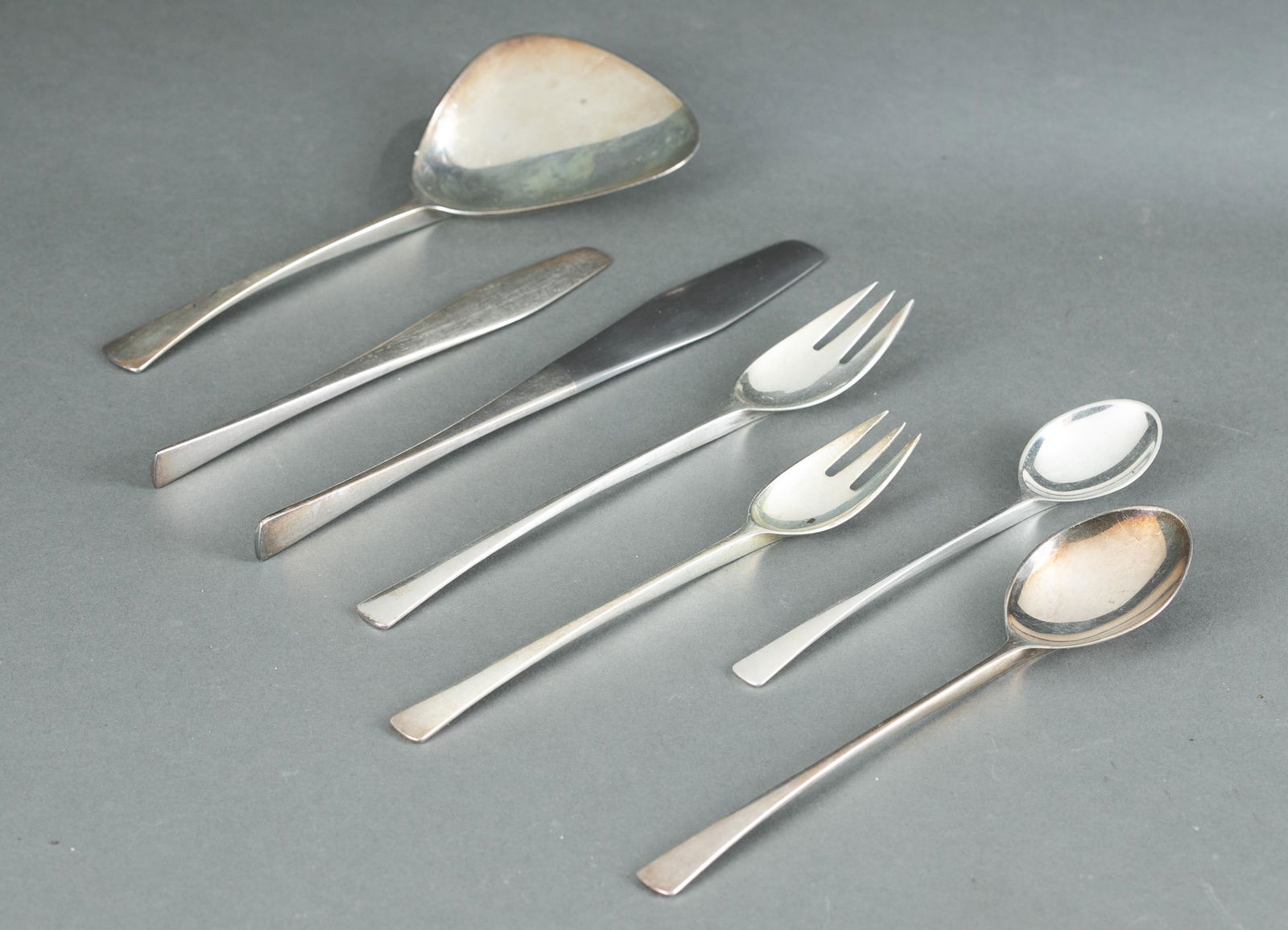 Dansk "Tjorn" sterling flatware service.: A Jens Quistgaard (Danish, 1919 - 2008) for Dansk "Tjorn" sterling flatware service. 23 pieces total. Five 6 7/8" forks, three 7 1/2" dinner forks, four 6" tea spoons, one 7 1/2" tablespoon, four 6 1/
