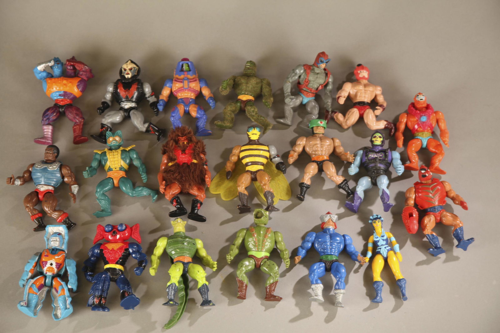 20 MOTU loose action figures.: A group of twenty Mattel Master's of the Universe loose action figures. Seven have original chest pieces. 5 1/2" tall.