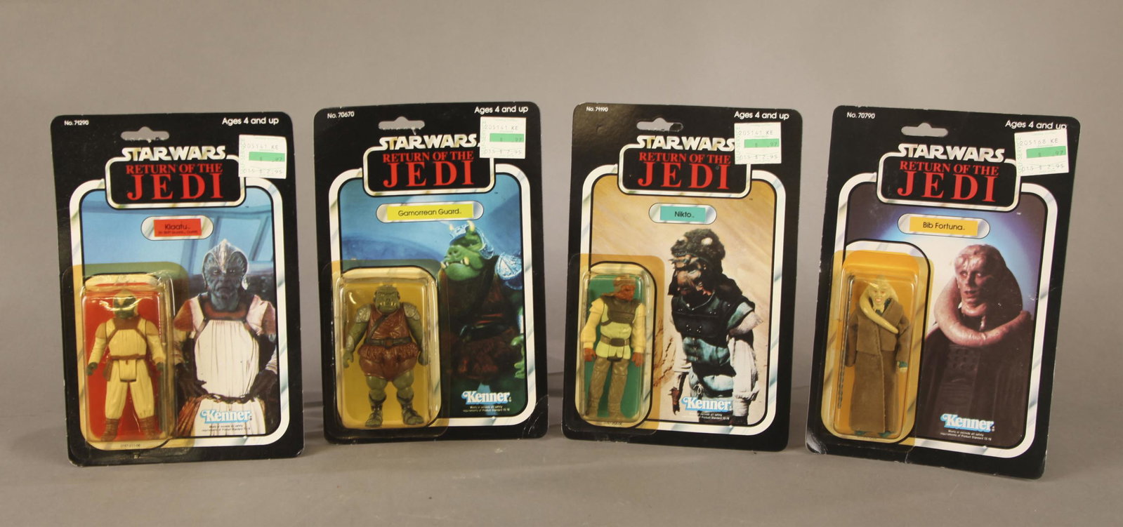 4 Star Wars ROTJ figures MOC.: A group of four Kenner Star Wars Return of the Jedi action figures. Punched mint on card. 1984 Klaatu without skirt. 1983 Gamorrean Guard. 1983 Bib Fortuna. 1984 Kikto. 9" x 6".Condition: Klaatu is cr