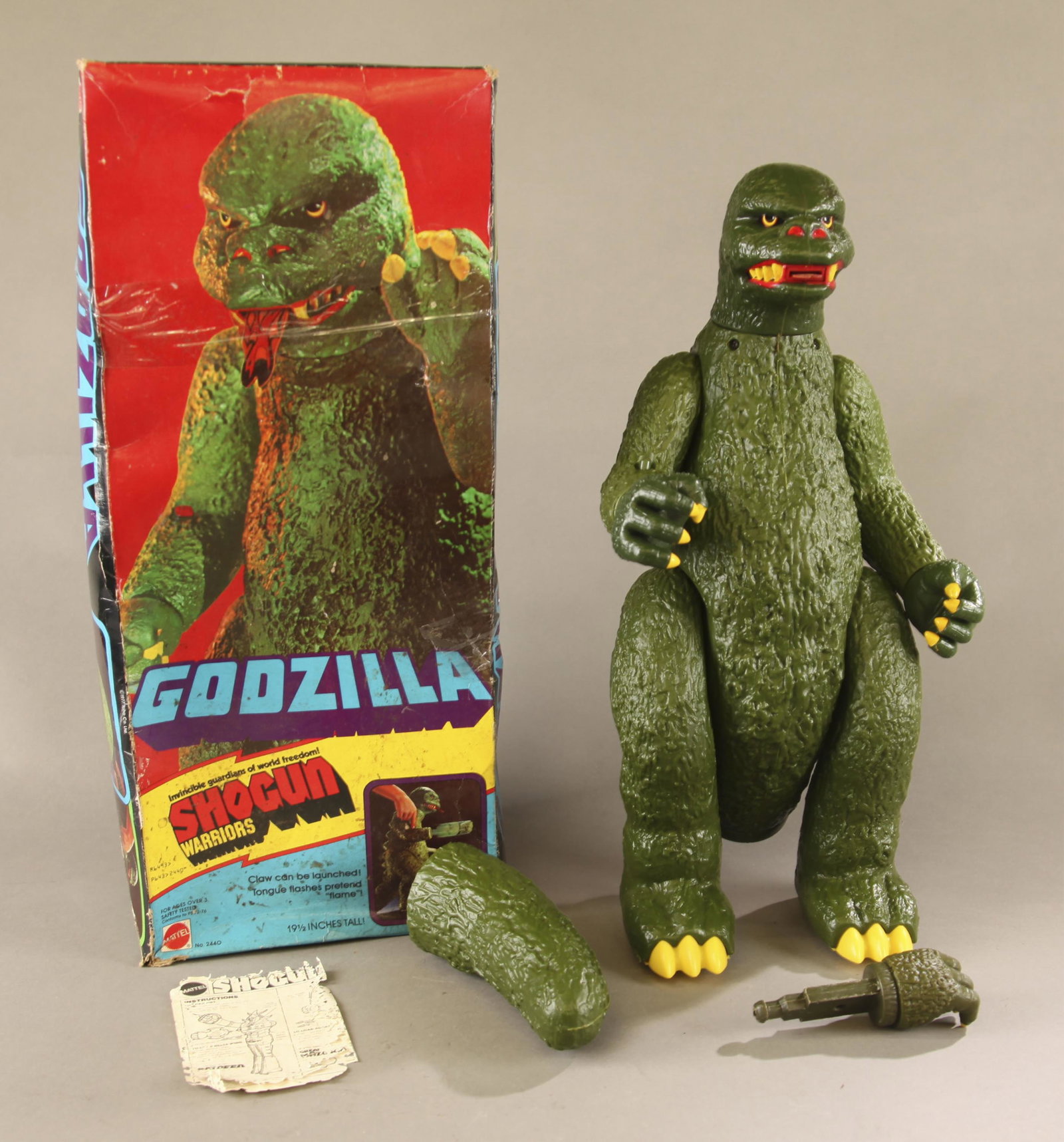 1st Issue Mattel Shogun Warrior Godzilla.: 1st Issue 1977 Mattel Shogun Warrior Godzilla in box. Original first edition made in Japan figure in 2nd issue U.S. made box. Figure features tail without ridges, lighter green color, and on bottom of