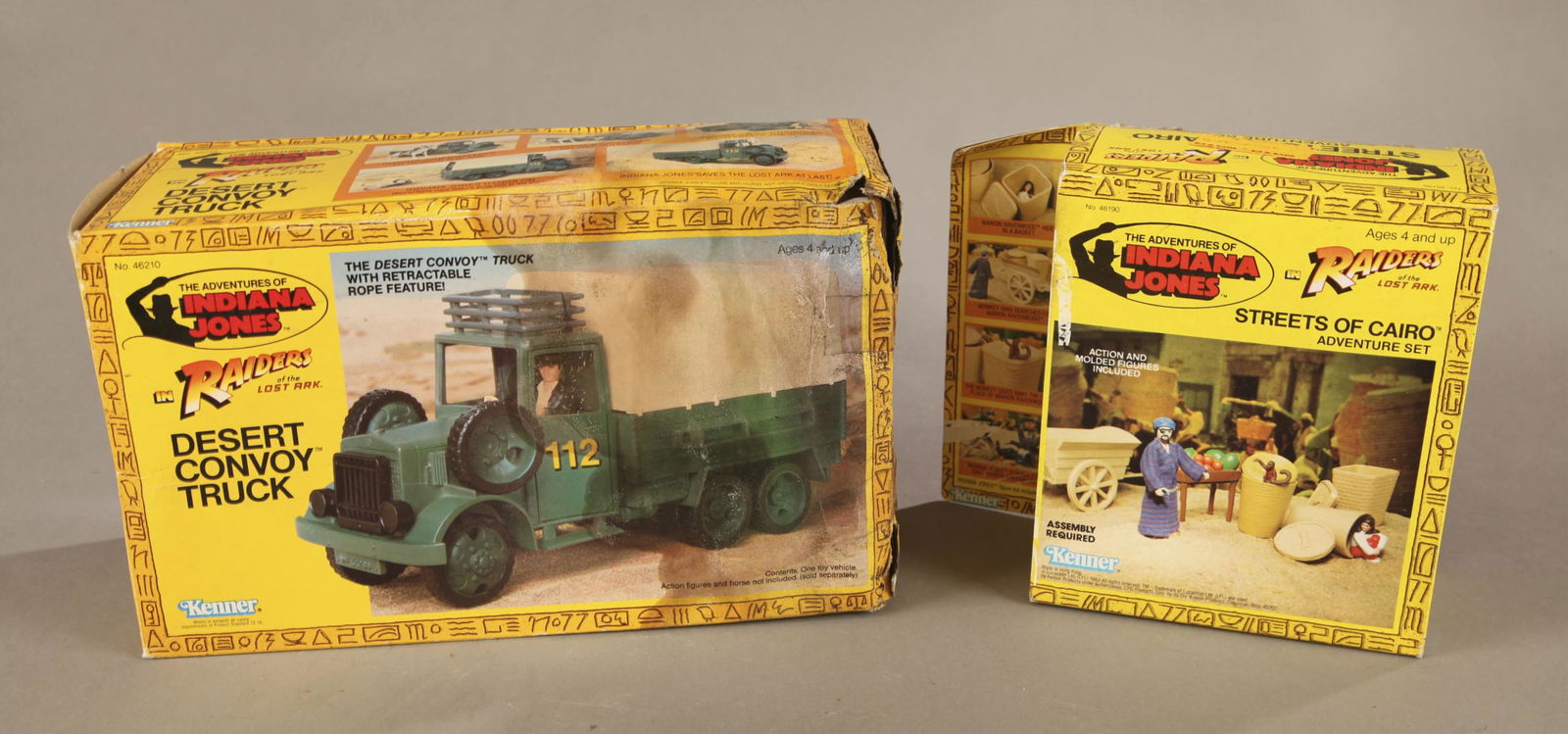 2 Indiana Jones ROLA sets MIB: A group of two Kenner 1983 Adventures of Indiana Jones: Raiders of the Lost Ark sets. Mint in box. Desert Convoy Truck. 7 1/2" x 12" x 4 3/4". Streets of Cairo adventure set. 7 1/2" x 8 1/4" x 3"Condi