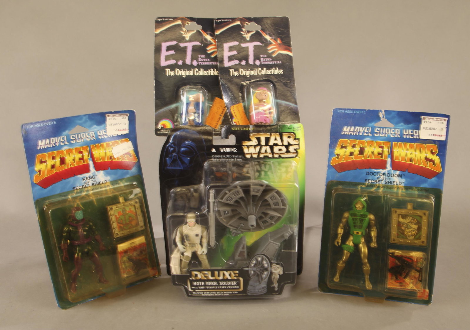 5 action figures MOC.: A group of five action figures. Punched mint on card. ++ Two 1984-1985 Mattel Marvel Super Heroes Secret Wars action figures. Doctor Doom and his Secret Shield. Kang and his Secret Shield. 10" x 6"1 x