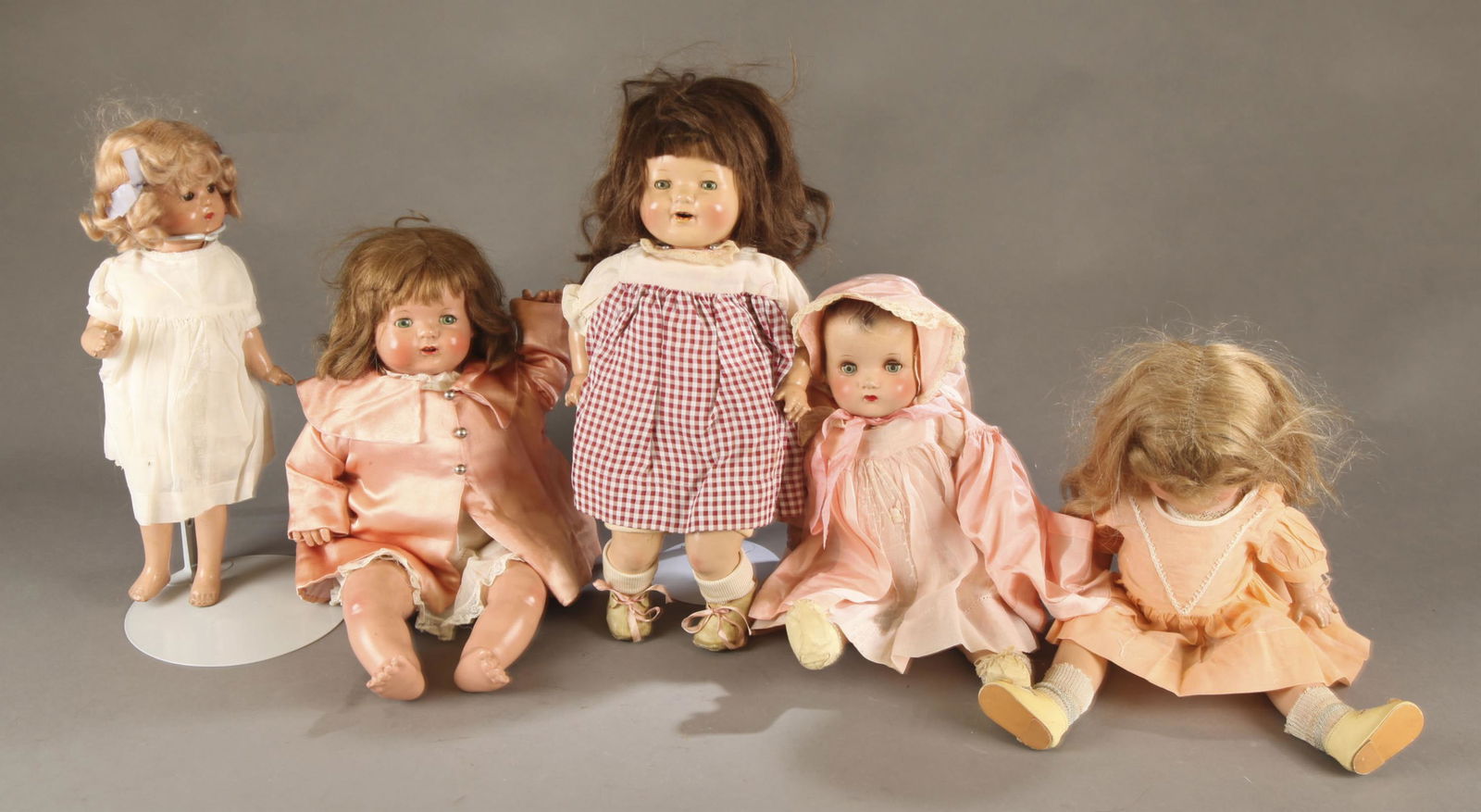 5 Composition dolls.: A group of five composition dolls, Circa 1930. ++ Effanbee Baby Evelyn composition baby doll. Brown hair with sleepy time eyes with eye lashes and open mouth. Marked on back of head 1937 in ink and "E