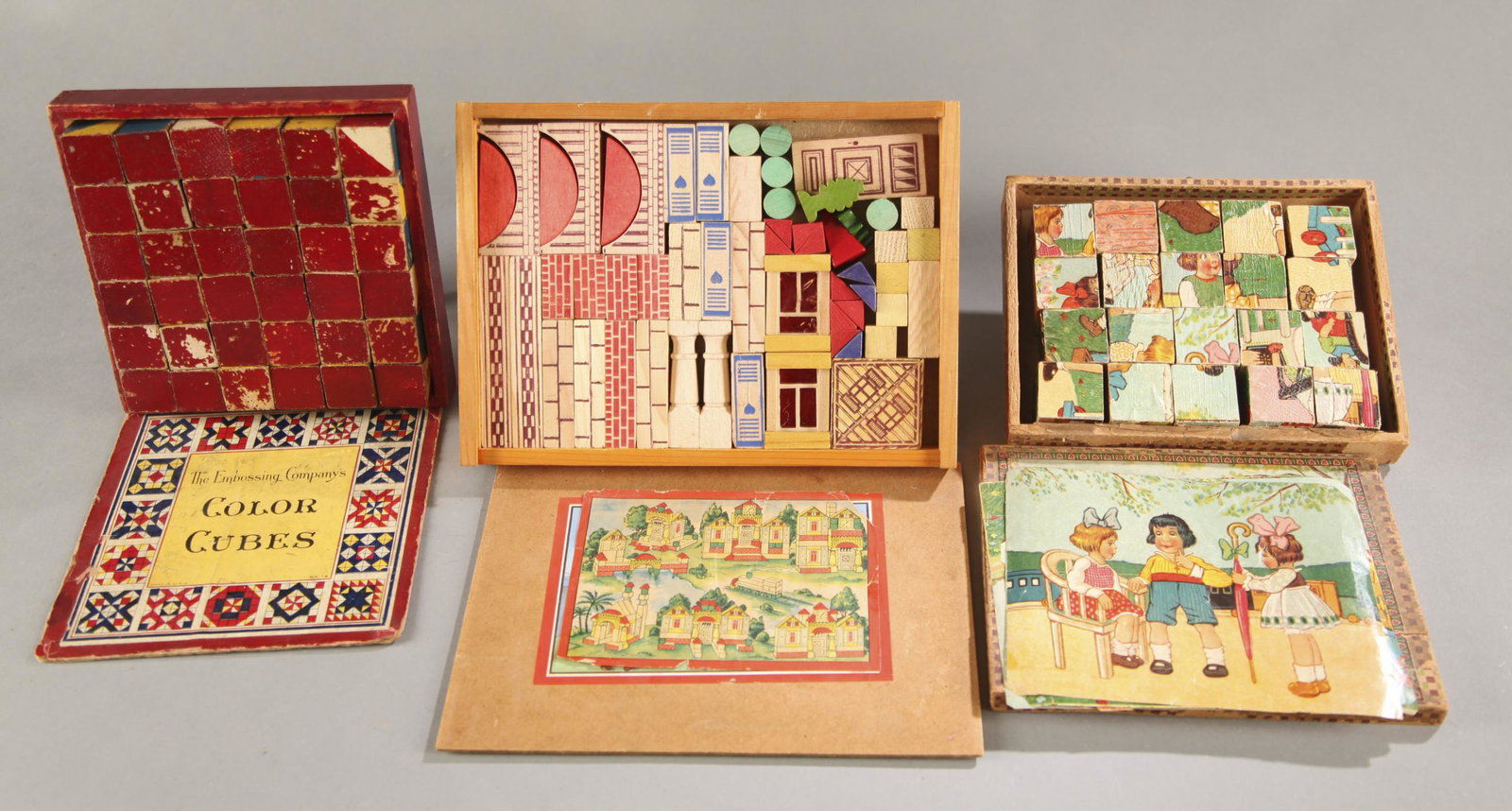3 Victorian wood toys.: A group of three Victorian wood toys. ++ Lithographed puzzle wood with 20 wood pieces. 1 3/4" x 8 1/4" x 6 1/2". ++ The Embossing Company's Color Cubes. Wood box with 12 wood blocks. 1 7/8" x 7 1/4" x