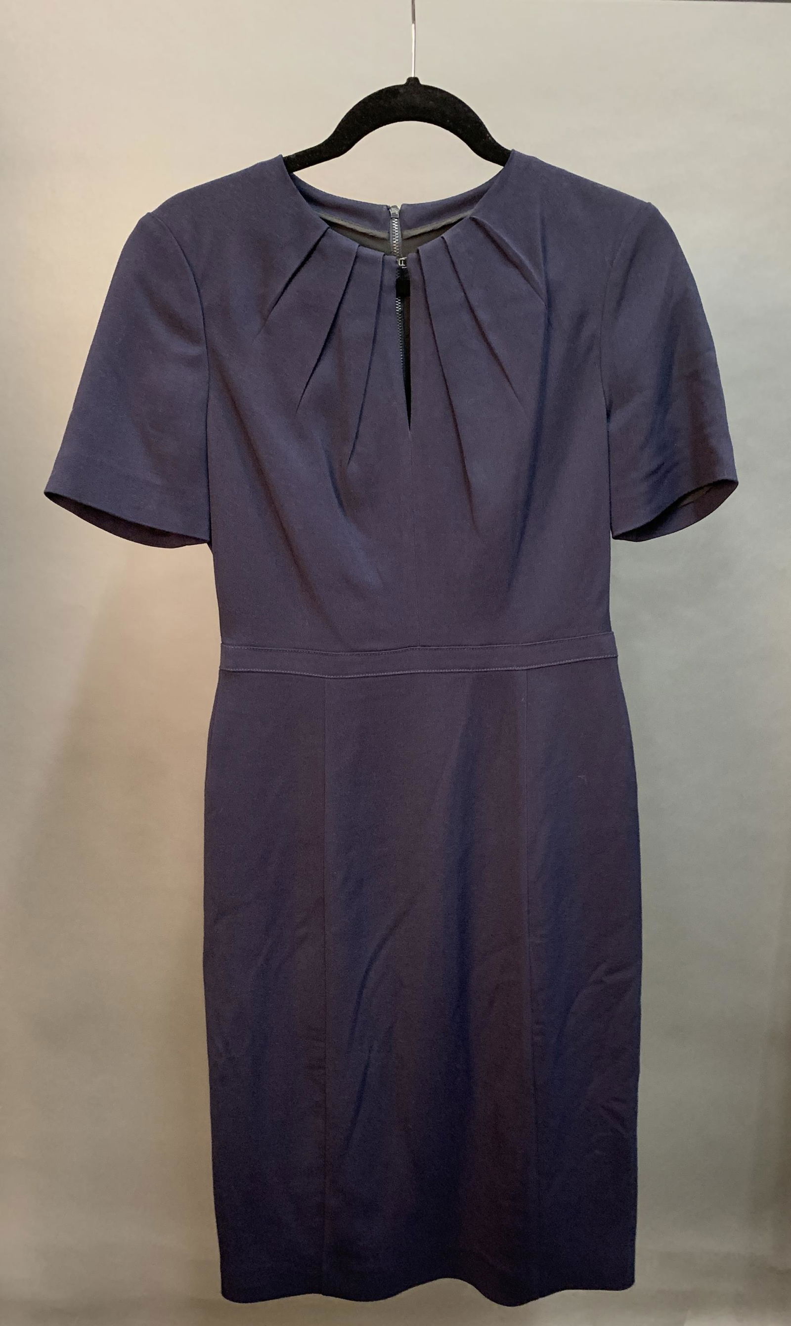 Burberry Dress.: A Burberry navy blue dress with peephole neck. Size 8.