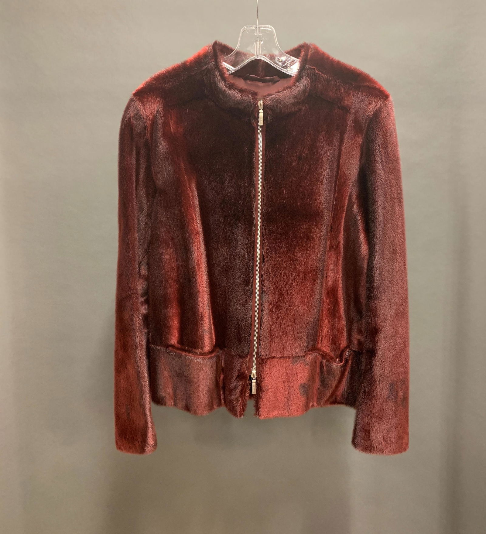 Loewe Seal Coat.: A Loewe Seal coat with forro lining and zipper. Dyed dark red. Length: 23". Bust: 36".