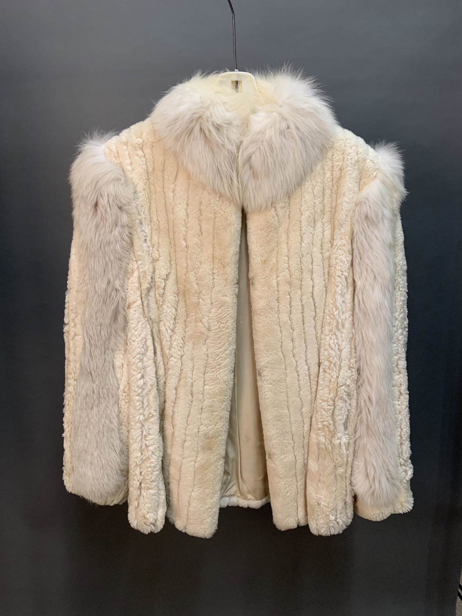 Rosendorf Evans Ermine Fur Coat.: A Rosendorf Evans white ermine fur coat with banded fox fur on sleeves and collar. Four hook closures. Monogrammed and embroidered interior. Size 12.