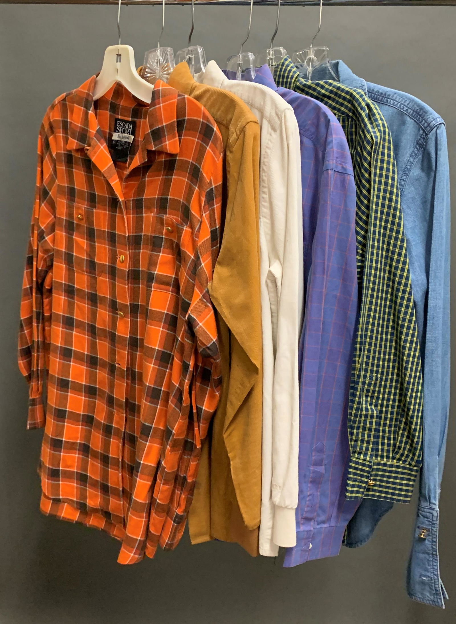 6 Escada Sport shirts.: A group of six Escada Sport long sleeve button up shirts. Size small, one medium. ++ Cream corduroy. ++ Tan corduroy. ++ Denim. ++ Purple plaid. ++ Orange plaid. Size medium. ++ Blue and green plaid.