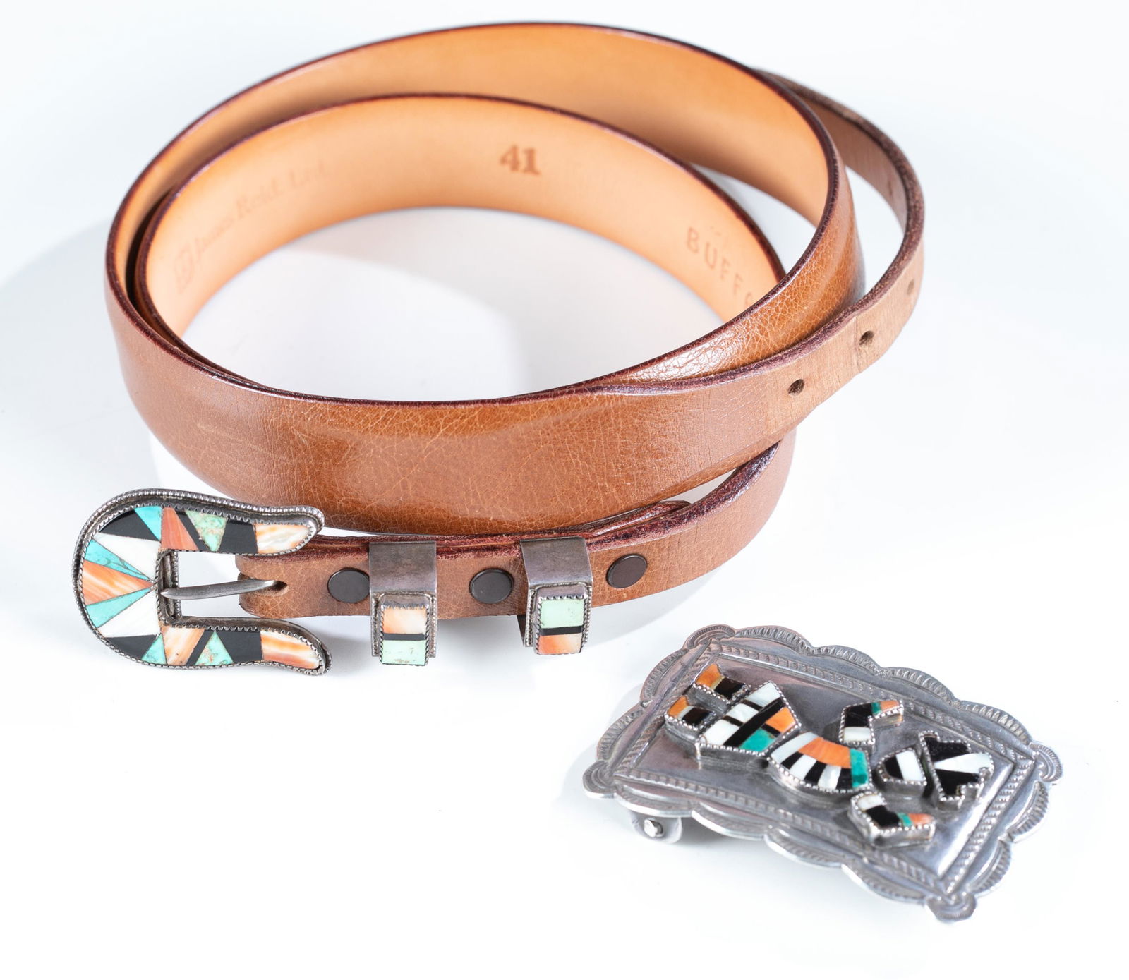 Southwest silver belt buckle and belt.: A Southwest silver and inlaid semi precious gemstone belt buckle and belt. ++ Silver belt buckle with figure of mixed stones, including onyx, abalone, turquoise, and carnelian. Signed on back illegibl