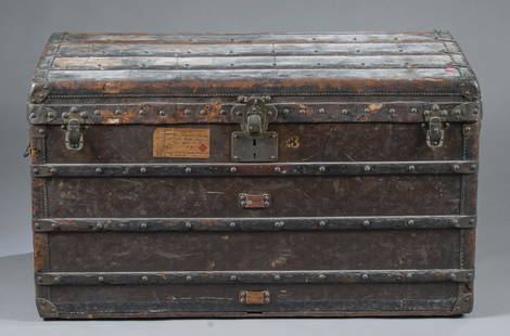 Canvas Louis Vuitton steamer trunk.: A canvas monogram Louis Vuitton steamer trunk, post 1914-1924. Louis Vuitton marked hardware and canvas with monogram stencil. Paper label inside lid. Missing insert. Numerous shipping labels. R.S.B.