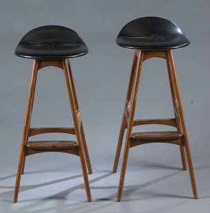 Pair of Danish Modern Eric Buch Od61 bar stools.: A pair of Danish Modern Erik Buch (Denmark, 1923-1982) Od61 bar stools for Oddense Maskinsnedkeri. Rosewood with leather seats. Oddense paper tag under seat. 33" x 14" x 14".Condition: Some marring