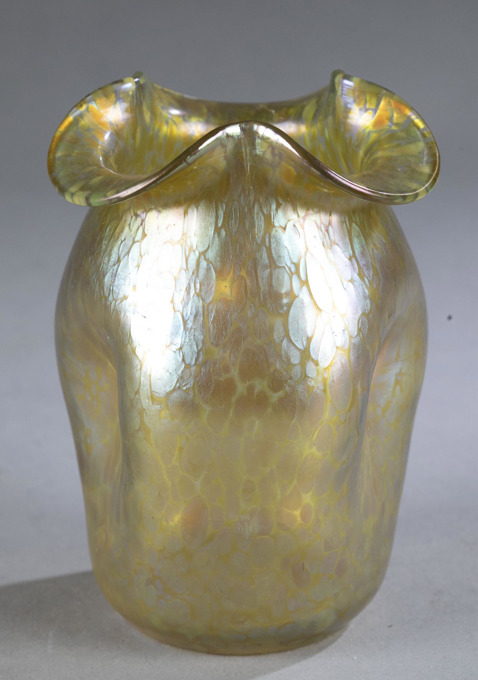 Loetz Art Nouveau Candia Papillon vase.: A Loetz Art Nouveau Candia Papillon vase. Circa 1900. Clear glass with the ''Candia Papillon'' decor and triple-pinched walls and ruffled mouth. Unmarked. 5 1/4" x 3 1/4". Condition: Wear around base 