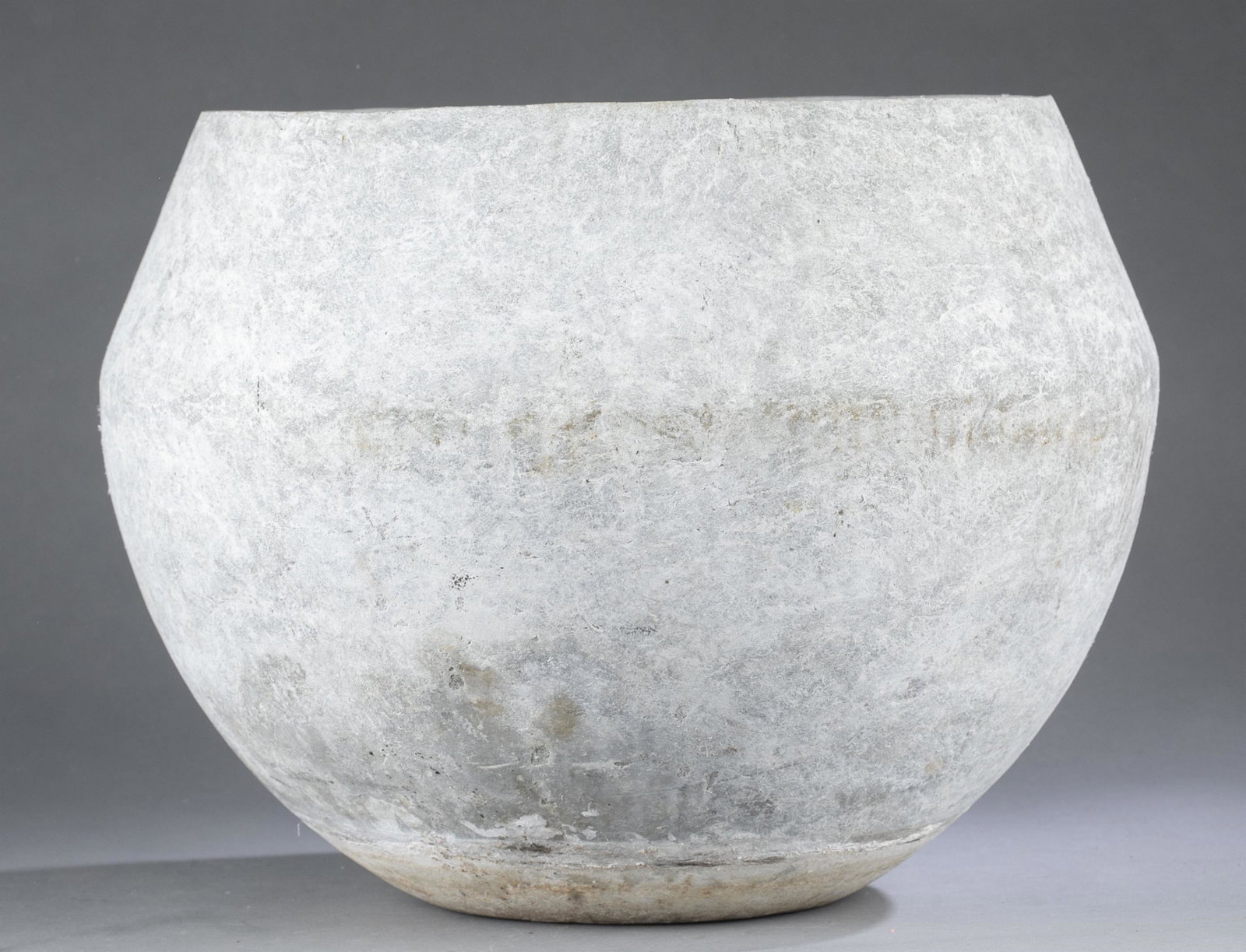 Willy Guhl style planter.: A Willy Guhl (Switzerland, 1915-2004) style bowl form planter. Atlas Asbestos Co. Montreal stamp on base. 12" x 15 1/2". Debris in interior.