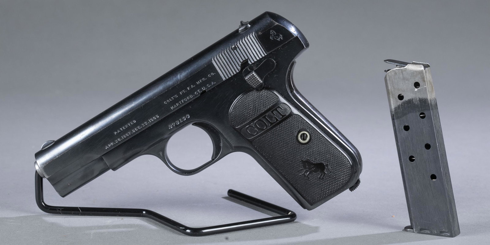 Colt M1903 Pocket semi auto pistol, .32 ACP.: 1918 Colt M1903 Type III Pocket hammerless semi auto pistol, .32 ACP. 3 31/2' barrel. Blued finish. Colt checkered rubber grips. Includes Colt seven shot magazine. 6 3/4" overall. Curio and Relic FFL 