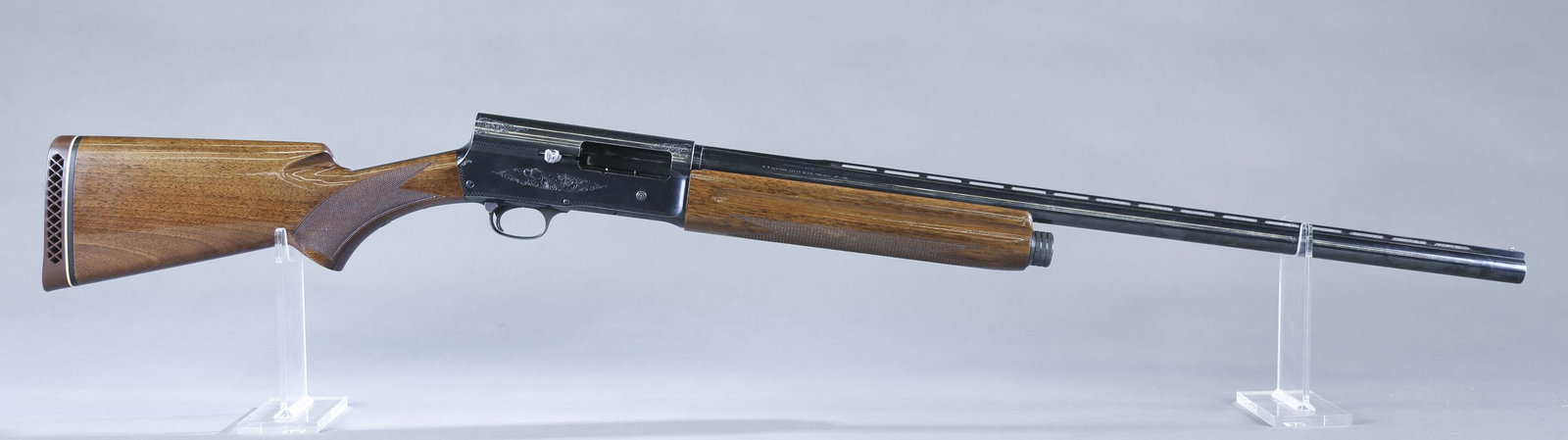 Browning Auto 5 semi auto shotgun, 12 gauge.: Browning Auto 5 semi auto shotgun, 12 gauge. 3" chamber. Circa 1973. Made in Belgium. 27" blued barrel with raised vent rib. Fixed Improved Cylinder chokes. Engraved blued receiver. Walnut semi pistol
