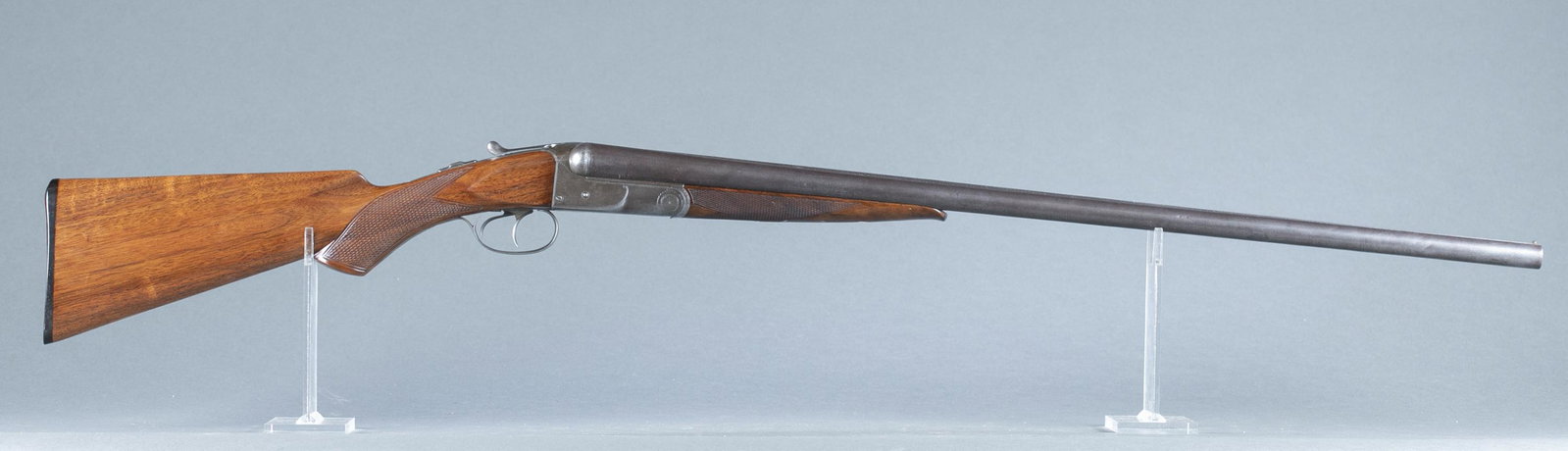 Antique Colt M1883 sxs shotgun, 12 gauge.: Antique Colt model 1883 side by side hammerless shotgun, 12 gauge. Circa 1895. 30" three stub Damascus barrel with extractor. Fixed chokes, Cylinder and Improved Modified. Barrel flats marked "COLTS P