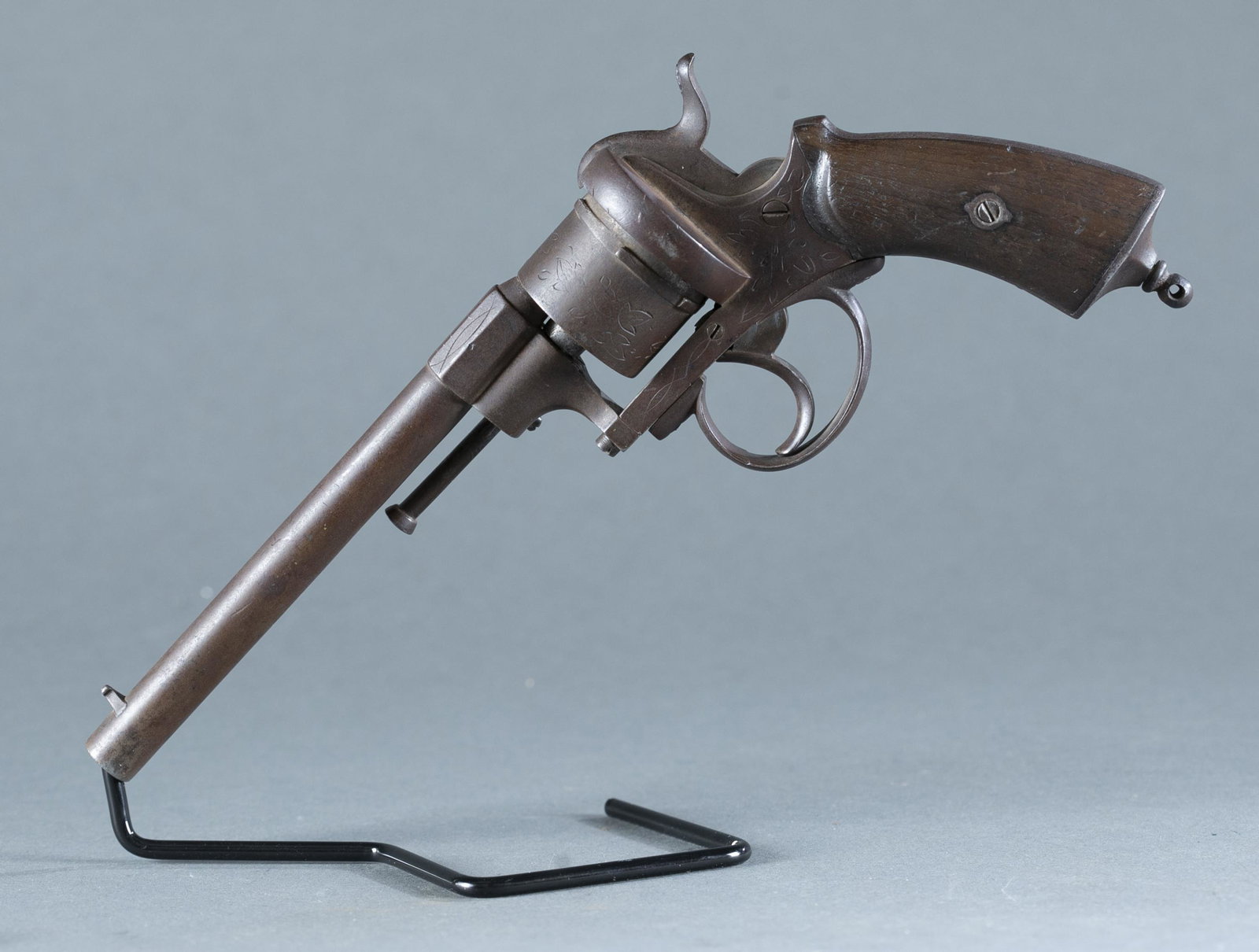 LeFaucheux type pinfire revolver, .35 cal.: LeFaucheux type pinfire six shot single action revolver, .35 caliber. 6" round barrel. Foliate engraved. Marked on cylinder E. over F.S. and crown over N on barrel. 10" overall. THIS IS AN ANTIQUE FIR