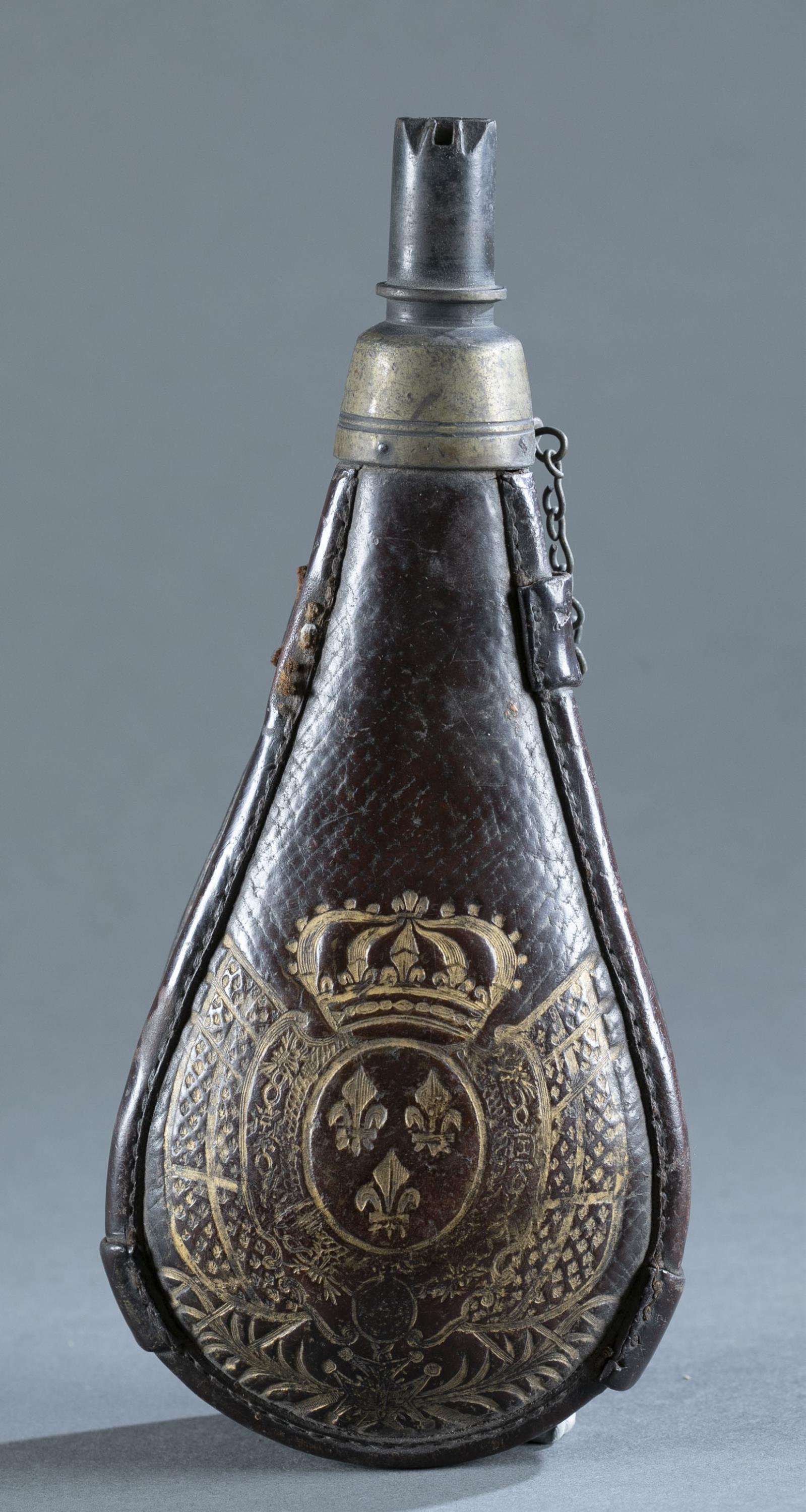 Antique French powder flask.: Antique French Bourbon Restoration powder flask, Circa 1814-1830. Leather of medal with embossed and gilded Bourbon heraldry. Open iron spout. Missing straps. 10" x 4 1/2" x 2 1/4" Provenance: From th