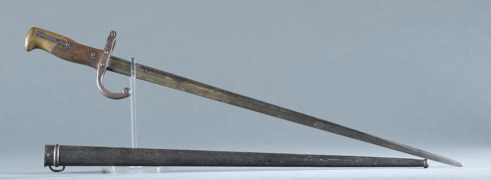 French M1874 sword bayonet.: French M1874 T-back sword bayonet for 11mm. M1874 Gras rifle. Manufactured by L. Deny, Paris, marked on spine with 1880 date. Serial 11301. Includes metal scabbard. 20 1/2" blade and 25 1/4" overall. 