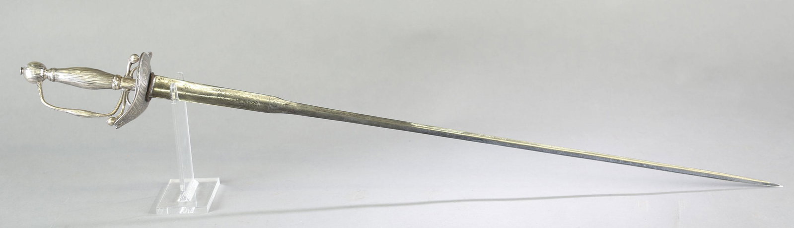 Louis XV French silver colichemarde sword.: Louis XV Paris silver guard colichemarde sword, circa 1744-1750. 31" steel blade. Engraved work on blade with classical scene with central figural bust. Rococo guard with rocaille twisting decoration 