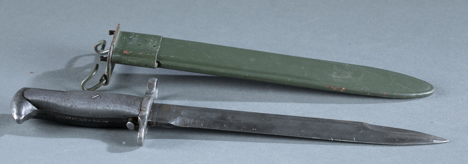 U.S. Utica Cutlery M1 bayonet.: U.S. Utica Cutlery M1 bayonet for M1 Garand rifle. 9 3/4" blade marked on ricasso "UC/ US" with ordinance mark. Markings on crossguard obliterated. M7 scabbard with ordinance mark obliterated. 14 1/2"