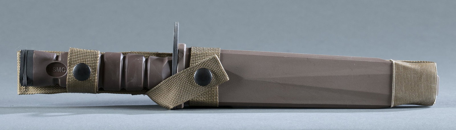 U.S.M.C. OKC-3S bayonet with scabbard.: U.S.M.C. OKC-3S bayonet for M16 with scabbard. 7 3/4" blade marked on ricasso "COMBAT USMC" and CKC 3S ONTARIO KNIFE CO." Rubber grip. 13" overall and 14" scabbard. Provenance: From the collection of 