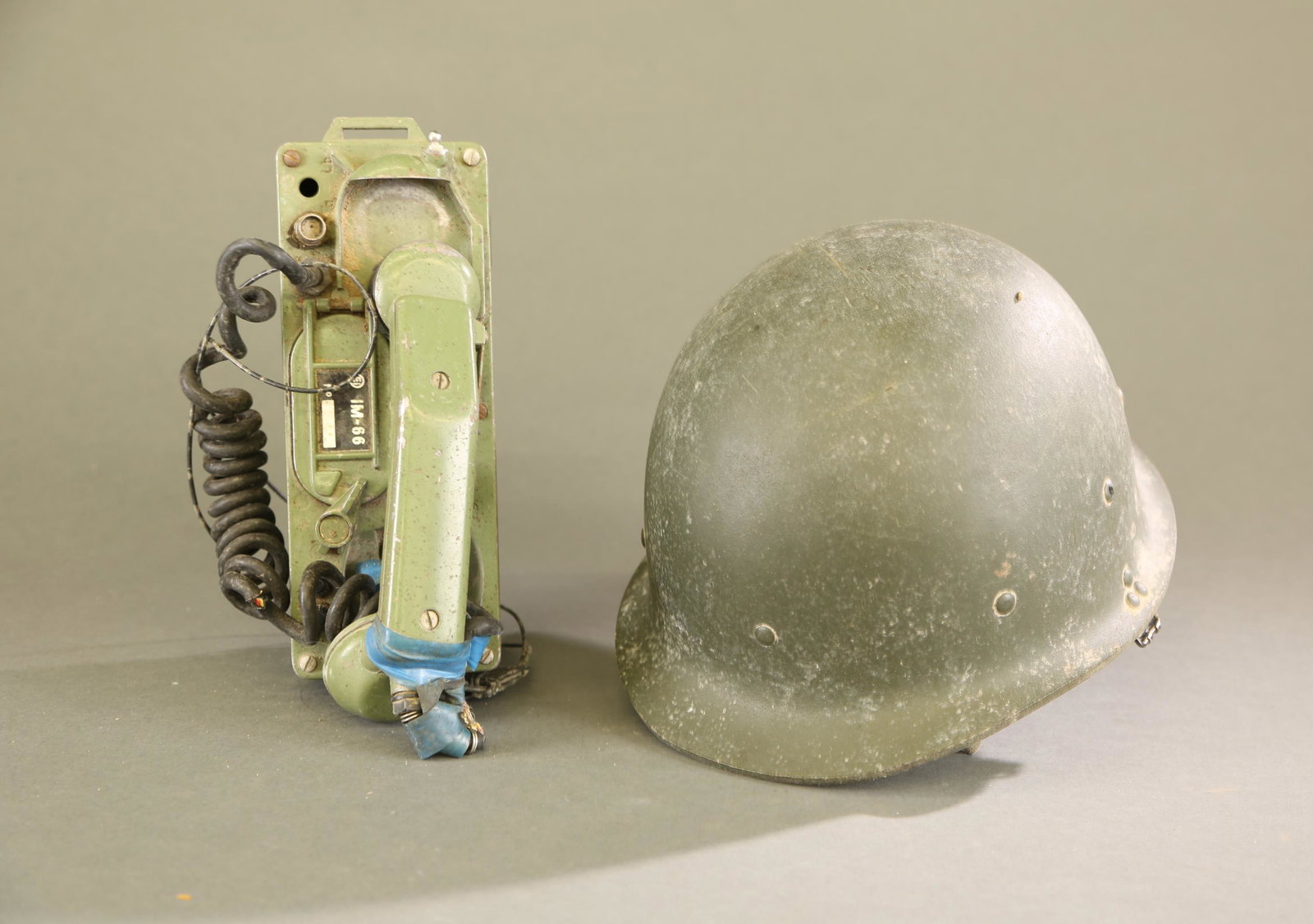 Desert Storm Iraq Army field phone and M80 helmet: Desert Storm Iraq Army Im-66 field phone and M80 helmet. Arabic writing on interior band. Phone: 5 1/2" x 9 1/4" x 3 1/2" and 7" x 11" x 9 1/2".