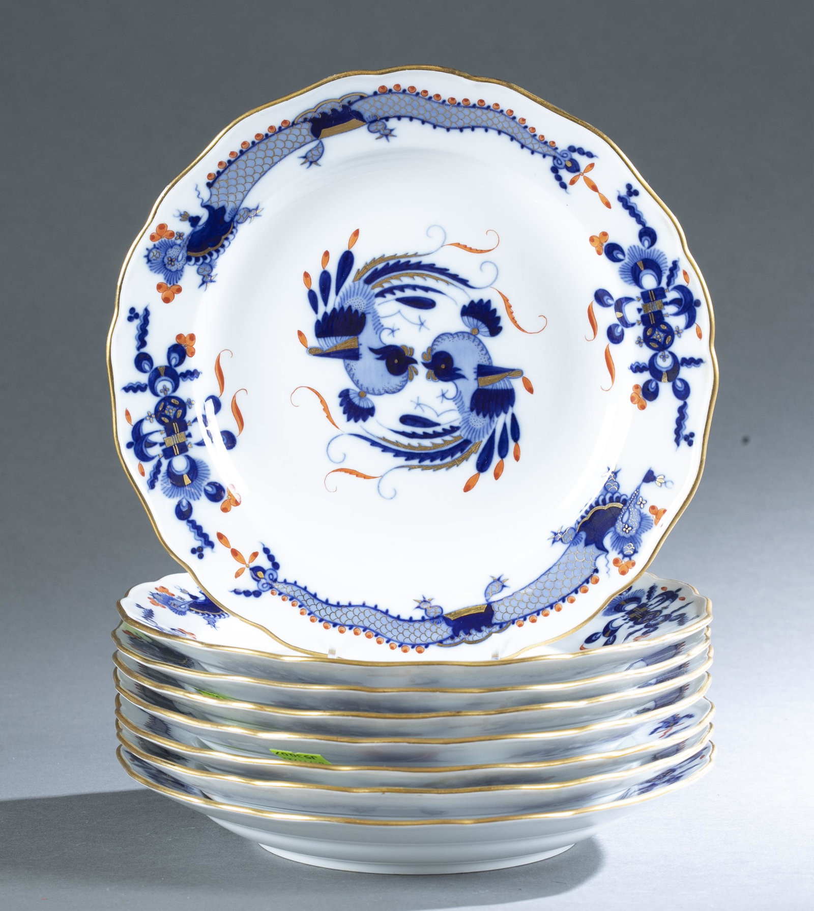 8 Meissen "Court Dragon" plates, 1815-1923.: A set of eight Meissen "Court Dragon" porcelain dinner plates with blue and red/orange dragons and geometric designs with gilding. Marked with blue crossed swords under glaze. Marked with "1 22" and "