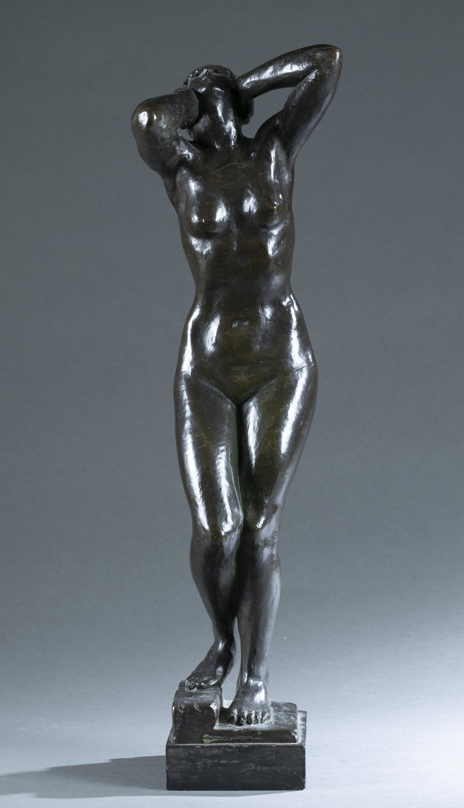 Jo Davidson, Bronze nude, 1912.: Davidson, Jo (New York, 1883-1952). Bronze sculpture of a woman looking upwards and grabbing her head while her proper right foot is propped on a step. Signed and dated "Jo Davidson Paris 1912" on bas