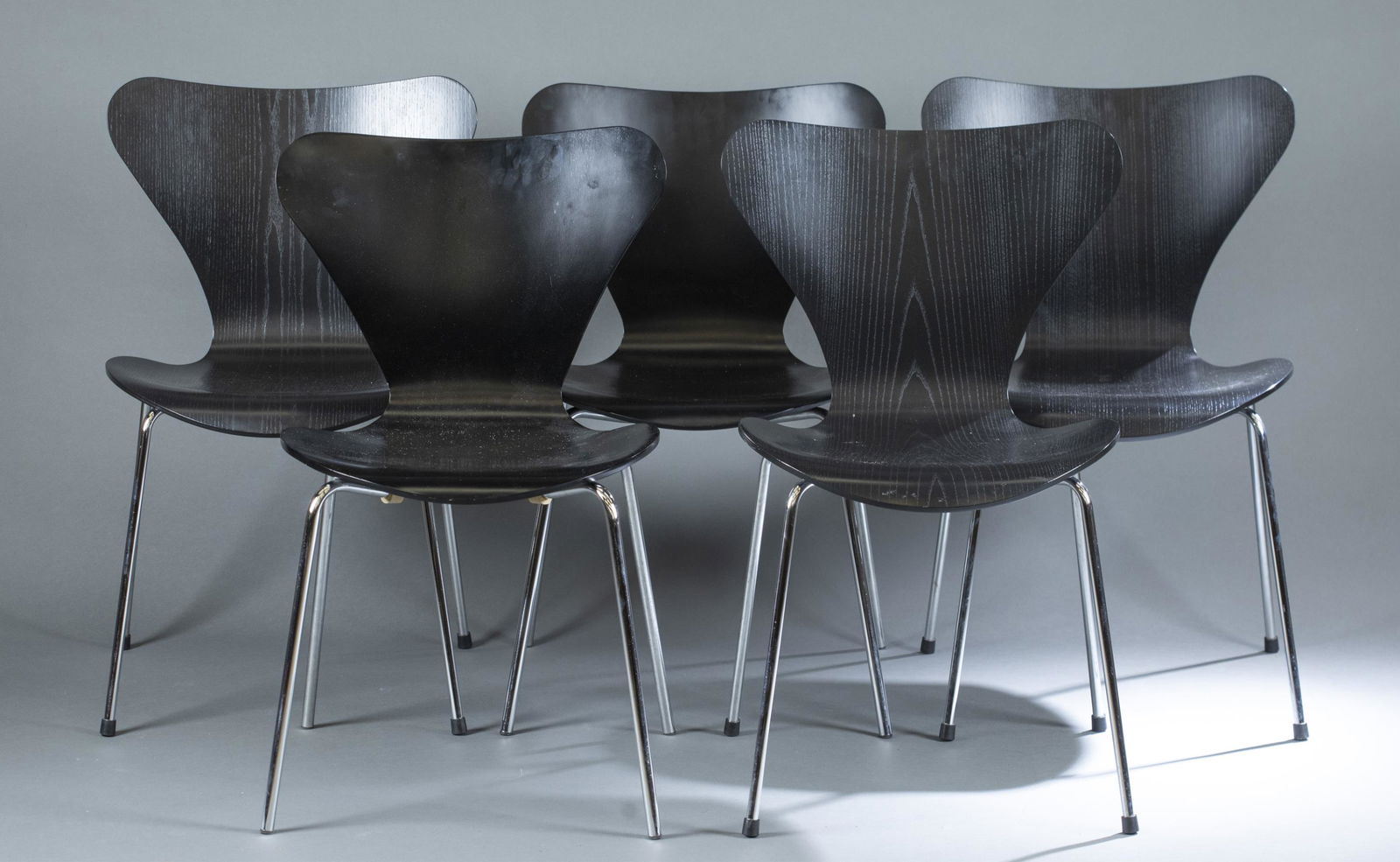5 Fritz Hansen Whale Tail chairs, 2006.: A group of five Whale Tail chairs designed by Arne Jacobsen for Fritz Hansen. Marked on bottom. 2006. 30 3/4" x 16 1/2". Condition: Light wear to seats, light abrasions.