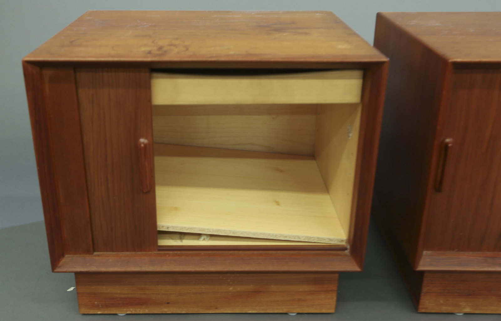 2 Falster teak night stands.: A set of two Falster teak night stands. Marked. Made in Denmark. 20" x 21 1/2" x 17 1/4". Provenance: From the collection of Virginia K. Saba.